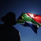 A South African flag is waved ahead of the 2010 FIFA World Cup.